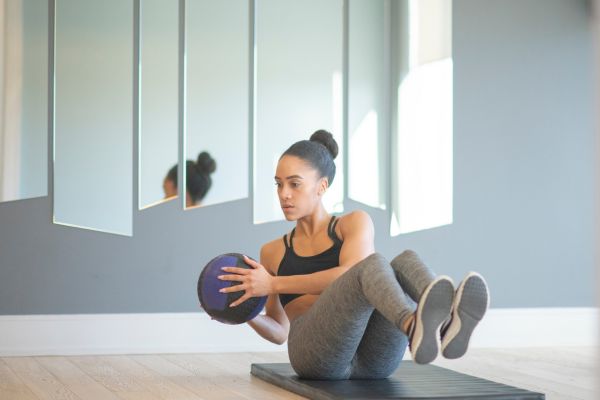 A personal trainer mastering her workout. 